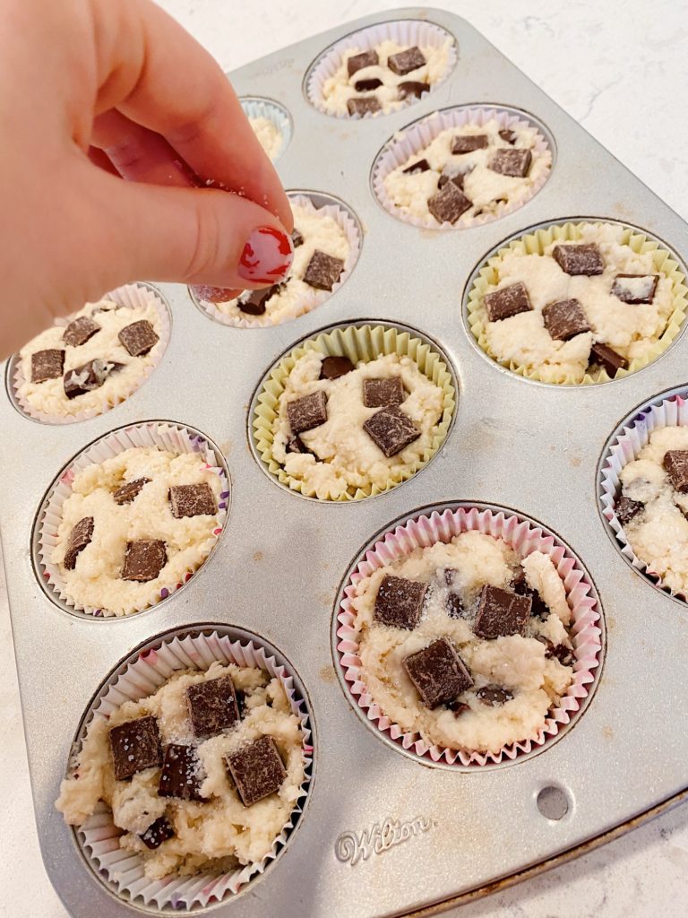 sprinkling toppings/sugar on best chocolate chip muffins