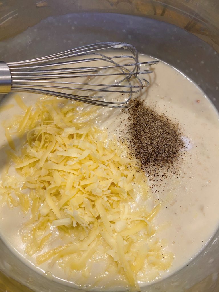 adding cheese to roux sauce